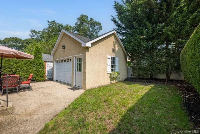 a patio with a table and chairs