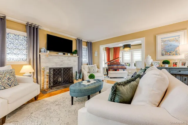 a living room with furniture fireplace and a flat screen tv