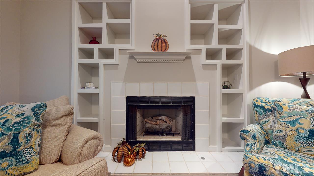 3827 Carnegie Lane Raleigh, NC 27612 - Photo 12 of 30 a living room with furniture and a fireplace