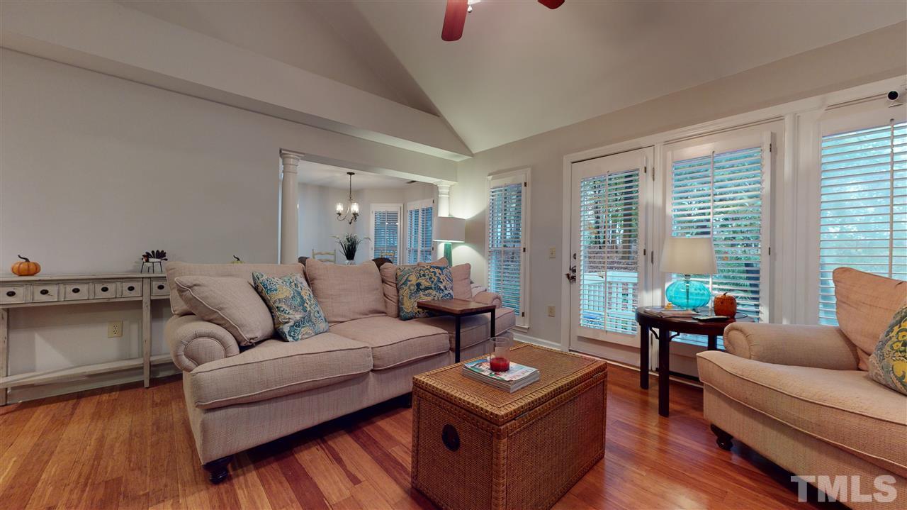 3827 Carnegie Lane Raleigh, NC 27612 - Photo 13 of 30 a living room with furniture and a wooden floor
