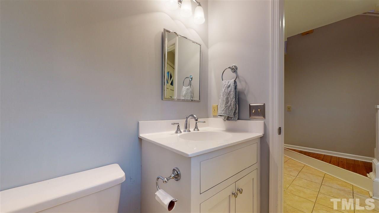 3827 Carnegie Lane Raleigh, NC 27612 - Photo 14 of 30 a bathroom with a sink and a mirror