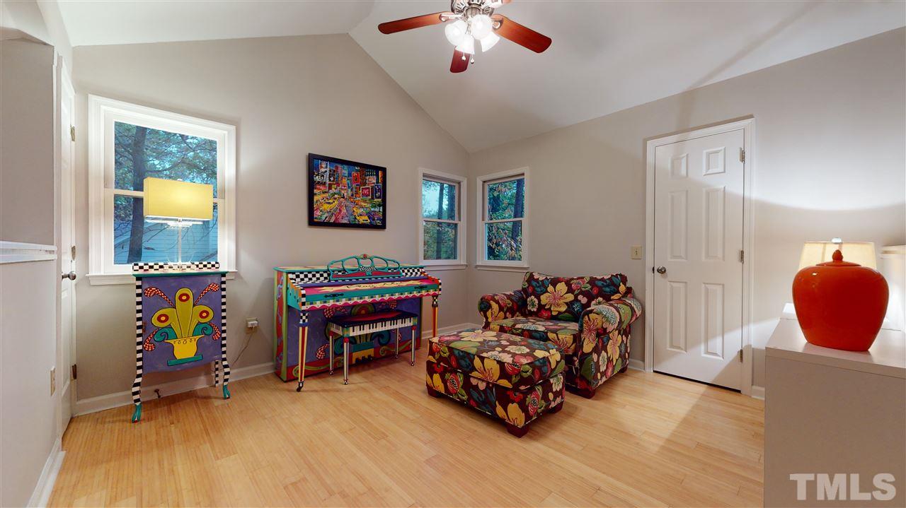 3827 Carnegie Lane Raleigh, NC 27612 - Photo 22 of 30 a bedroom with bed and a window