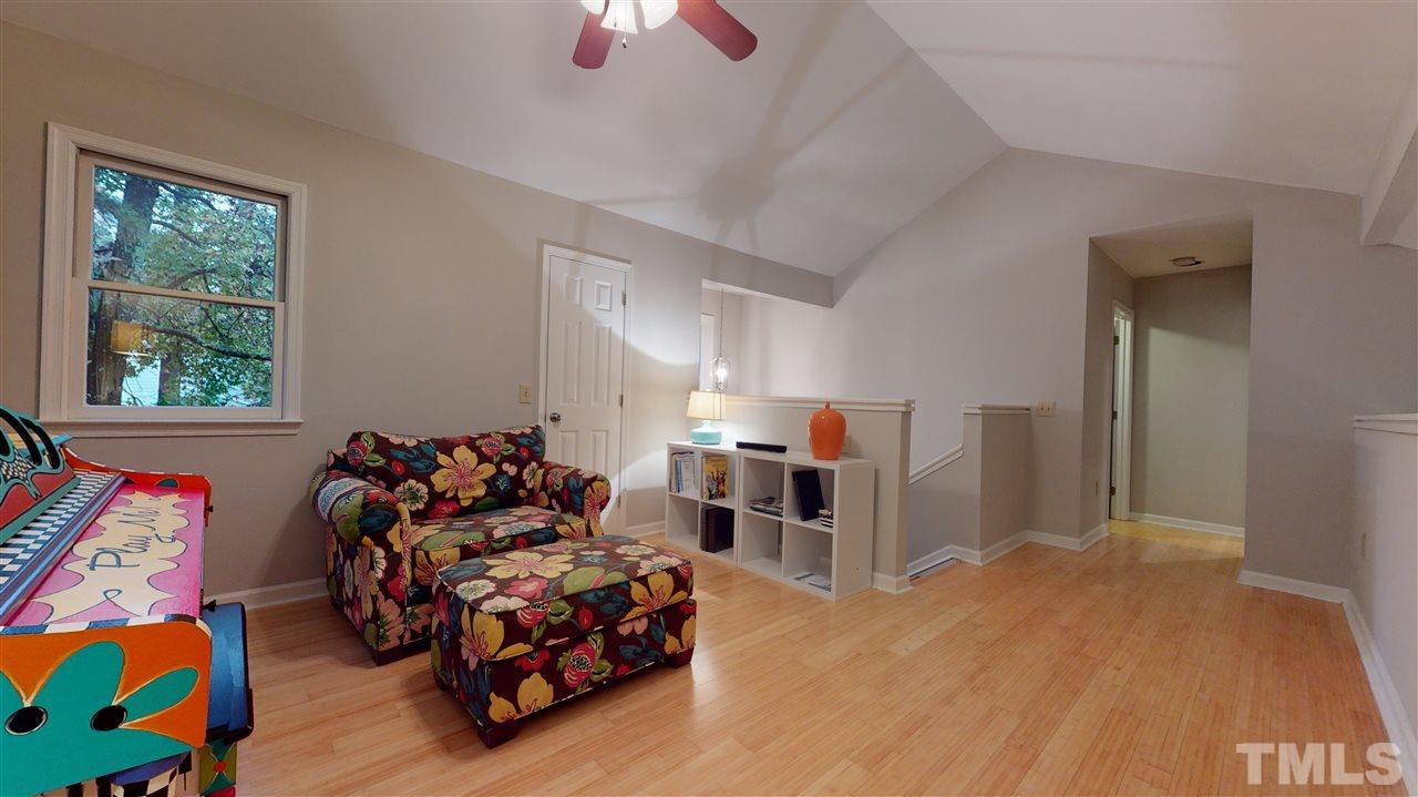 3827 Carnegie Lane Raleigh, NC 27612 - Photo 23 of 30 a bed room with furniture and a window