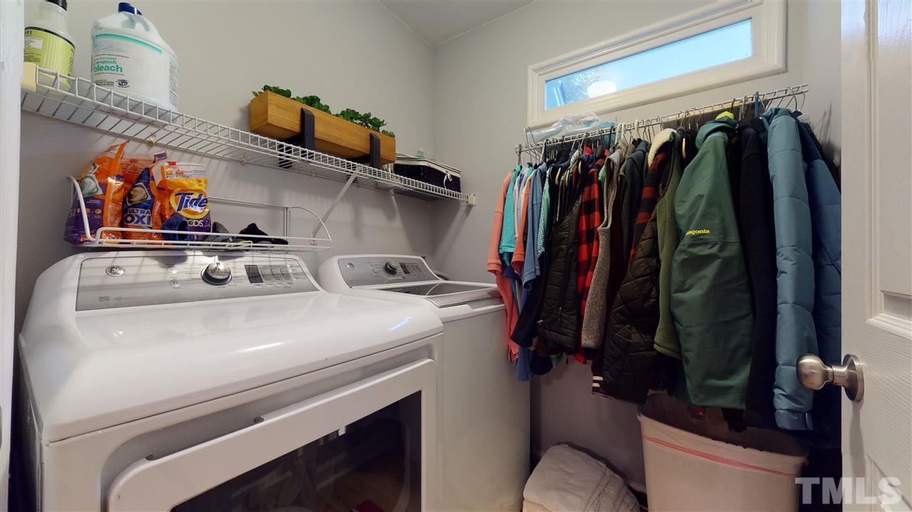 3827 Carnegie Lane Raleigh, NC 27612 - Photo 27 of 30 a view of walk in closet with clothes and shoes