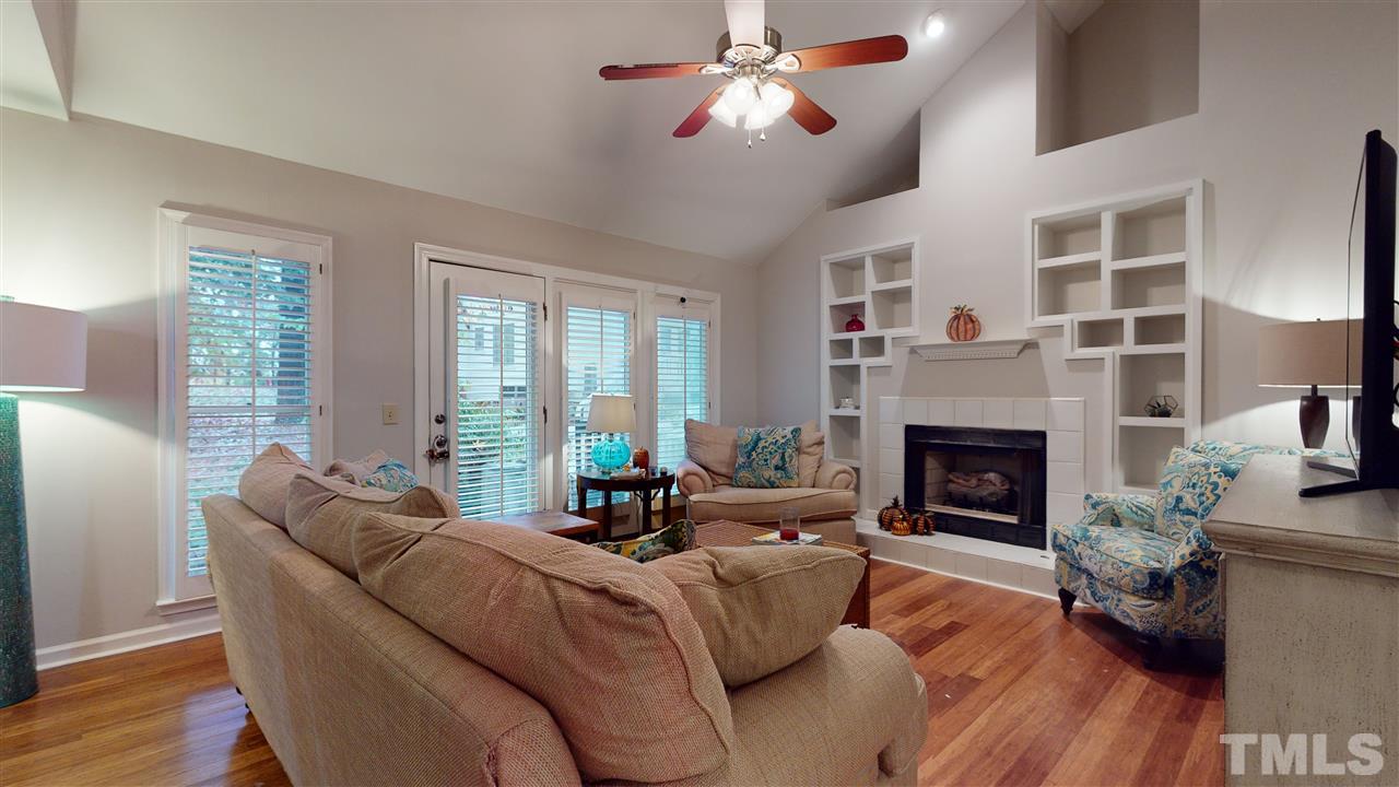 3827 Carnegie Lane Raleigh, NC 27612 - Photo 10 of 30 a living room with furniture and a fireplace