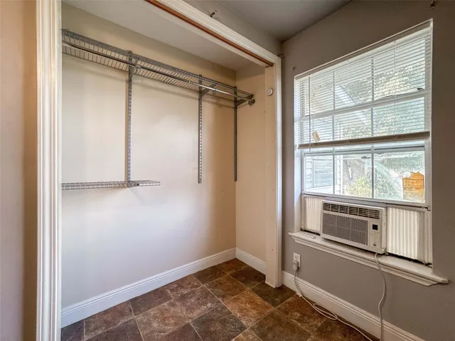 a view of storage and utility room with washer and dryer