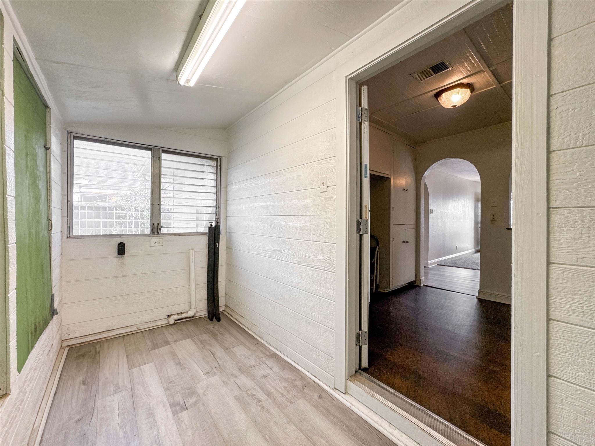 8321 Leander Street Houston, TX 77012 - Photo 14 of 23 wooden floor in an empty room with a window