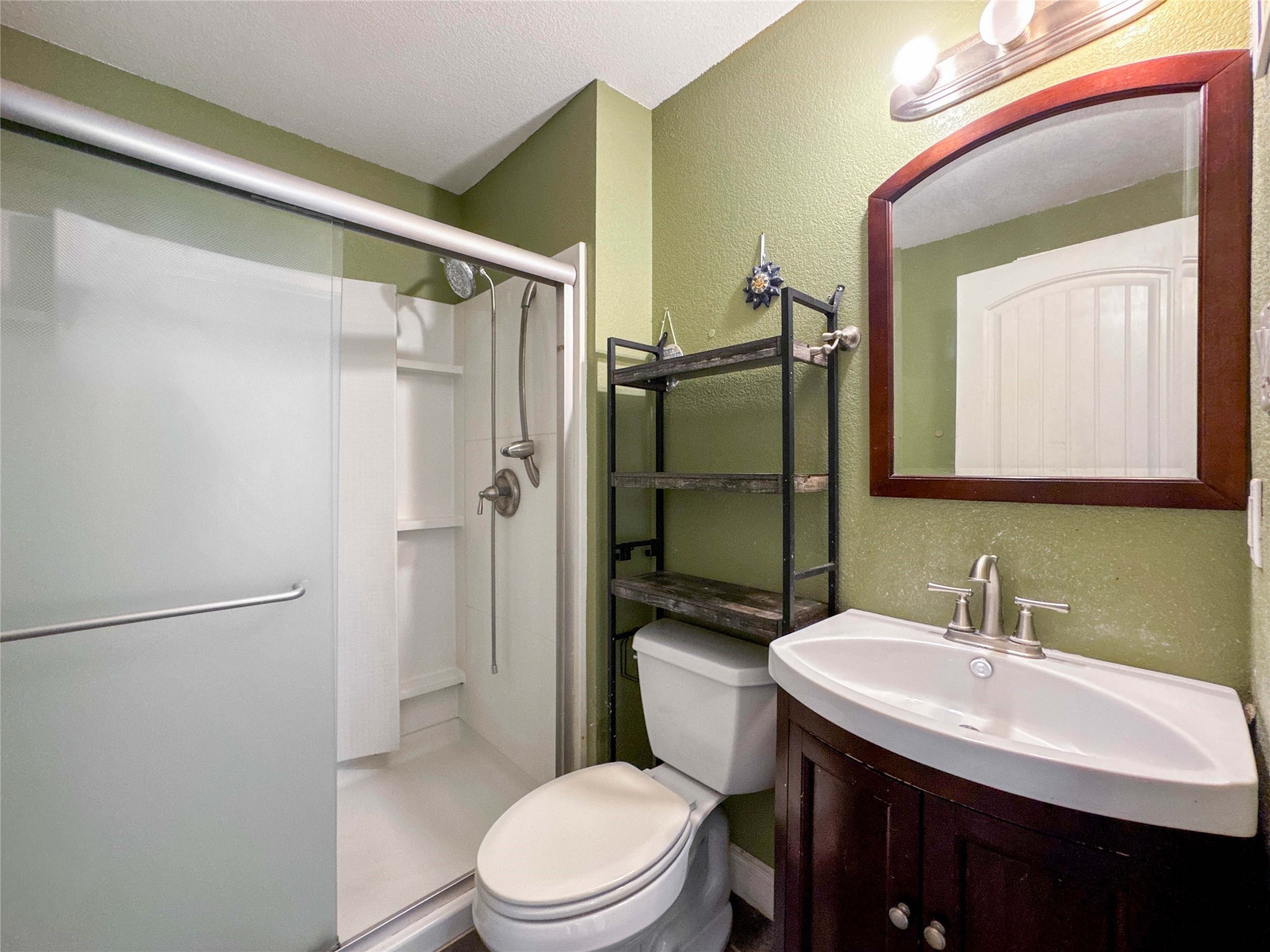 8321 Leander Street Houston, TX 77012 - Photo 17 of 23 a bathroom with a sink toilet and shower