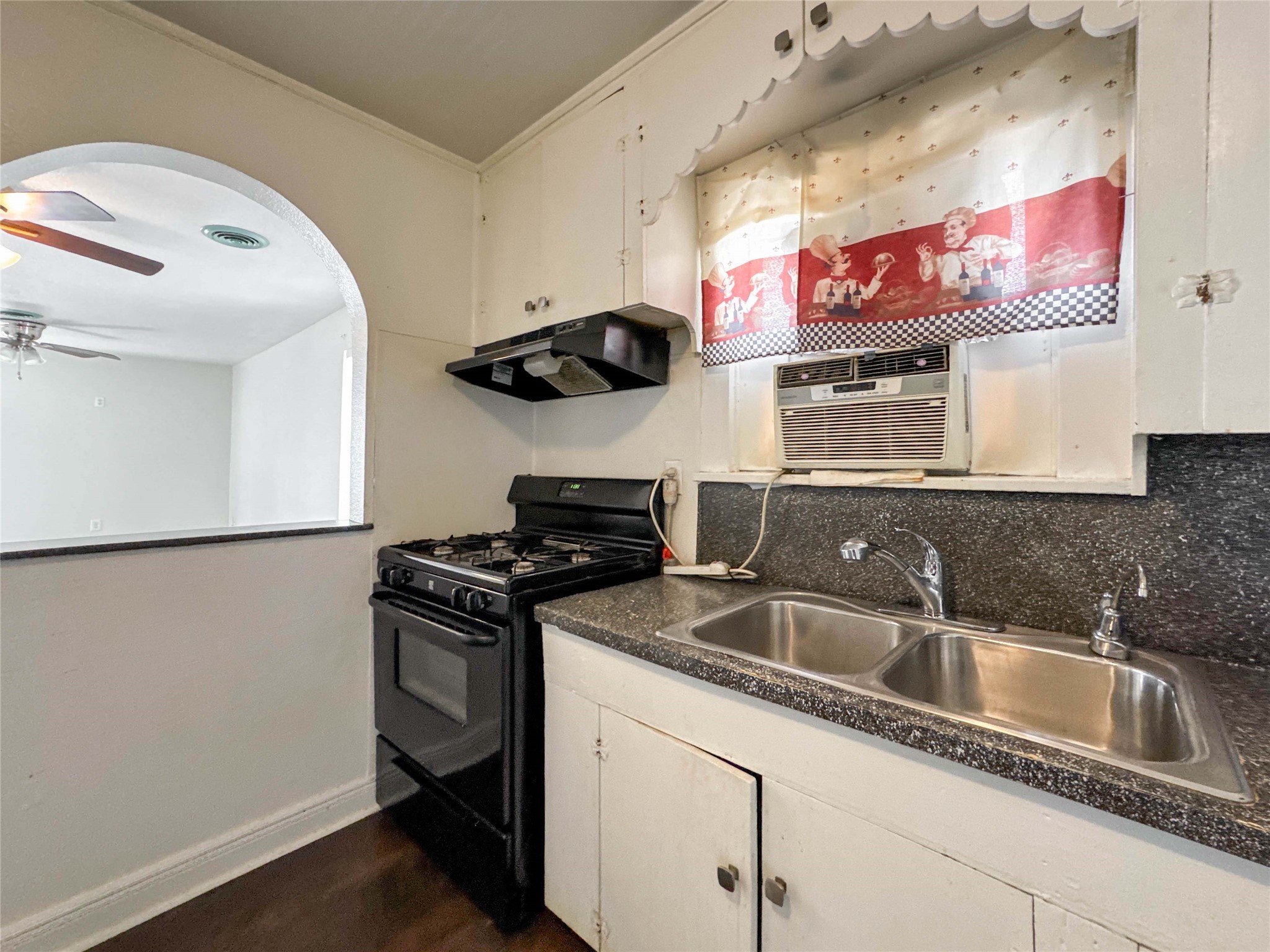 8321 Leander Street Houston, TX 77012 - Photo 6 of 23 a kitchen with stainless steel appliances granite countertop a sink stove and refrigerator