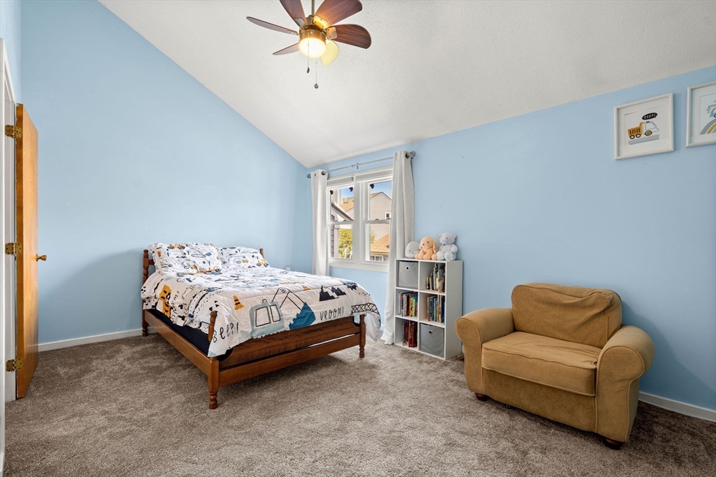 2 Halsey Way, Unit 40C Salem, MA 01970 - Photo 11 of 19 a bedroom with a bed couch and window