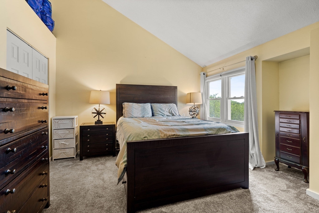 2 Halsey Way, Unit 40C Salem, MA 01970 - Photo 14 of 19 a bedroom with a bed and furniture
