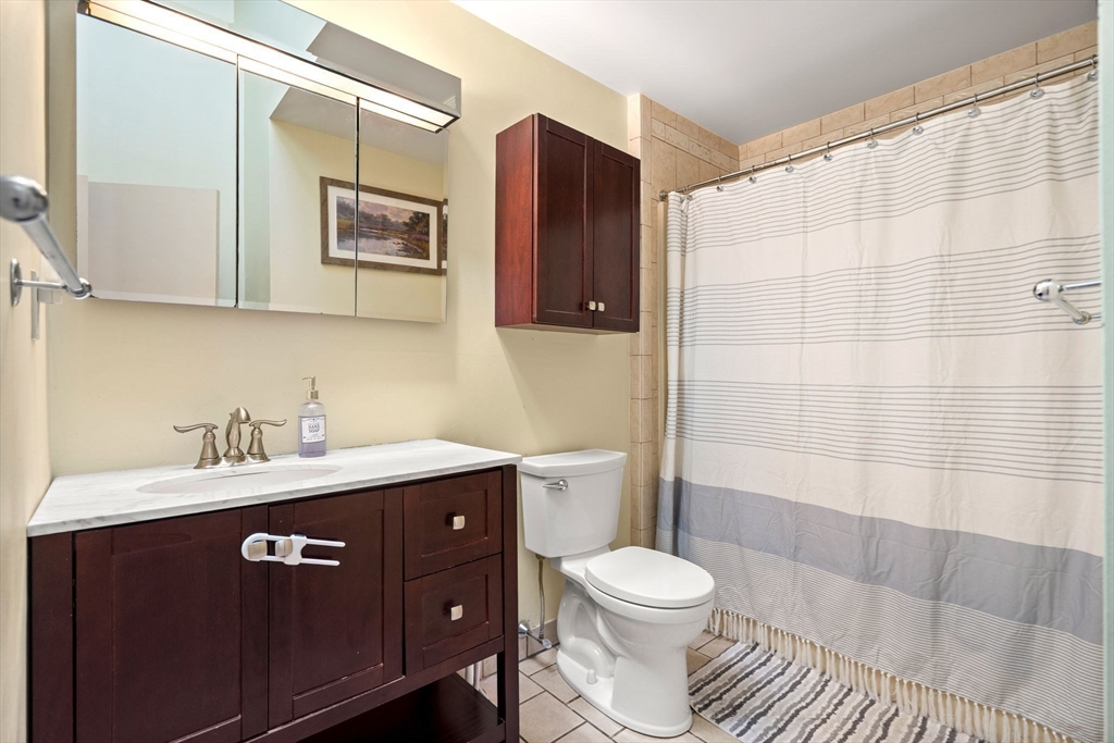 2 Halsey Way, Unit 40C Salem, MA 01970 - Photo 15 of 19 a bathroom with a sink a toilet and shower