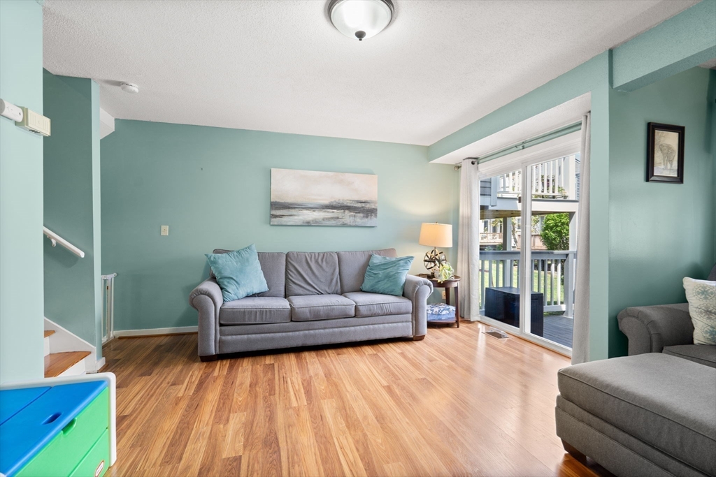 2 Halsey Way, Unit 40C Salem, MA 01970 - Photo 3 of 19 a living room with furniture and a large window