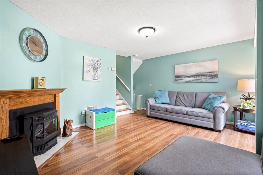 2 Halsey Way, Unit 40C Salem, MA 01970 - Photo 4 of 19 a living room with furniture and a wooden floor