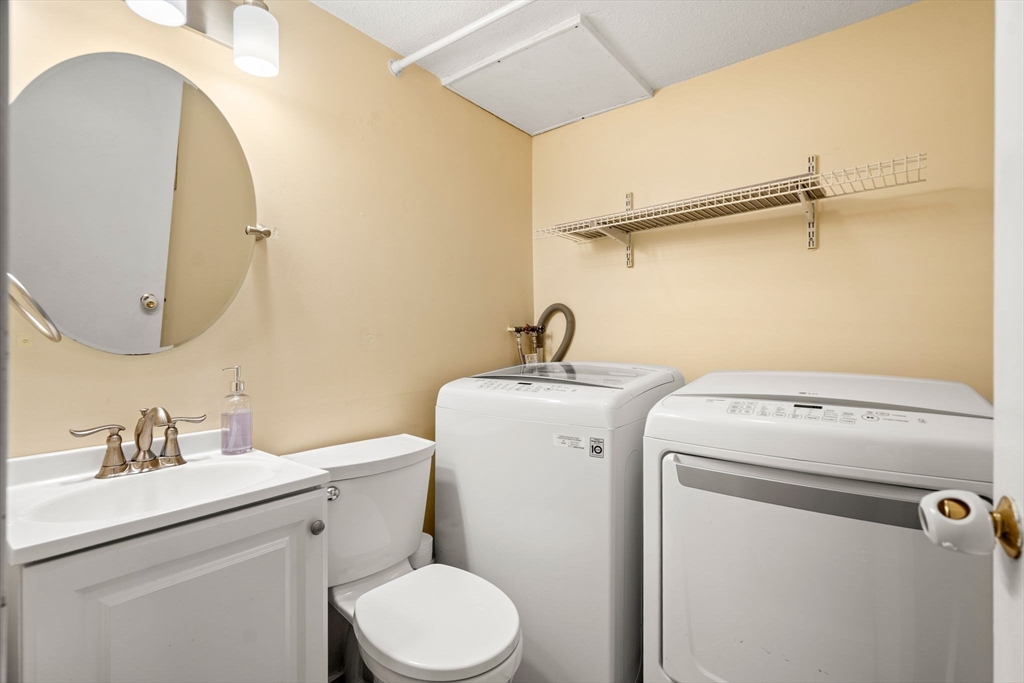 2 Halsey Way, Unit 40C Salem, MA 01970 - Photo 10 of 19 a bathroom with a sink and a toilet