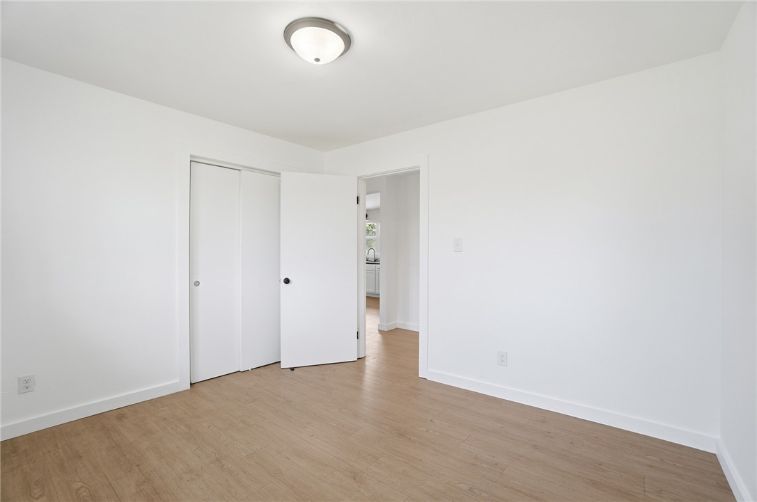 3991 Benner Road Miamisburg, OH 45342 - Photo 26 of 44 This bright room features a spacious closet and durable flooring, offering a versatile living space.