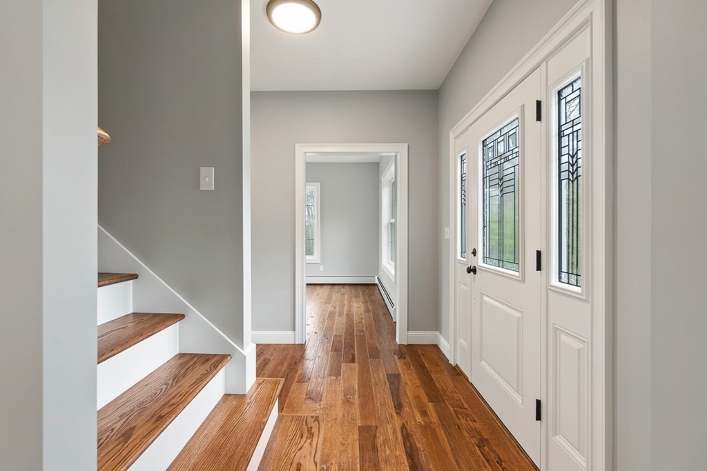 1499 South Athol Road Athol, MA 01331 - Photo 3 of 21 a view of a hallway with wooden floor and staircase