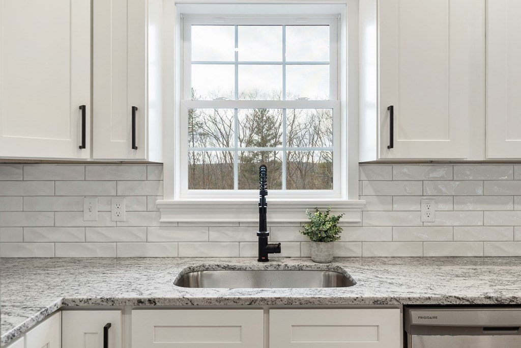 1499 South Athol Road Athol, MA 01331 - Photo 8 of 21 a kitchen with granite countertop a sink a potted plant and a window