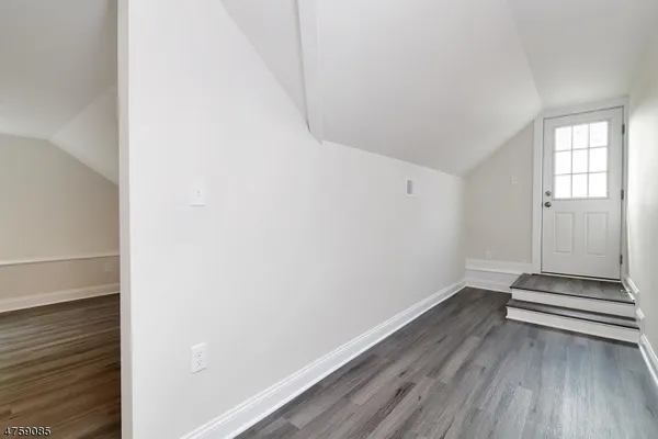 a view of room with stairs and a window
