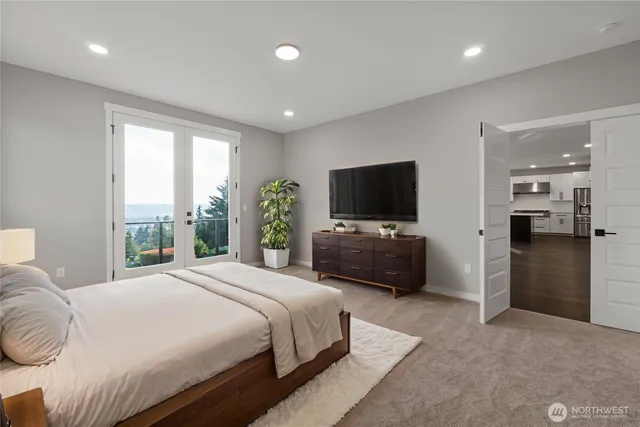 a bedroom with a bed and a television in it