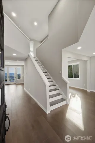 a view of entryway and hall with a window