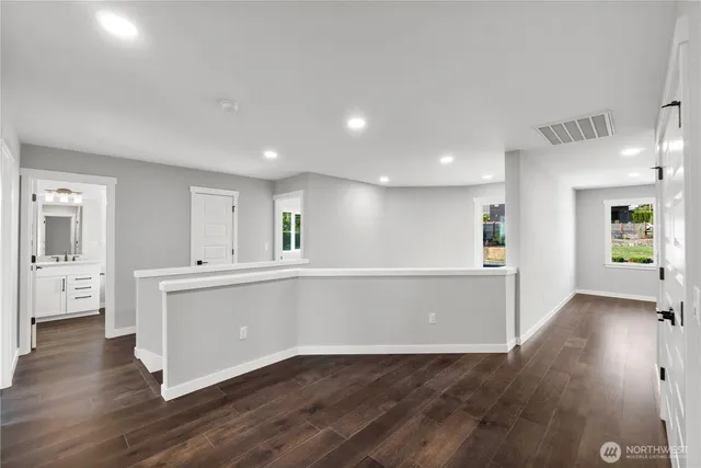 a view of kitchen with wooden floor and window