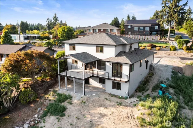 a aerial view of a house with a yard