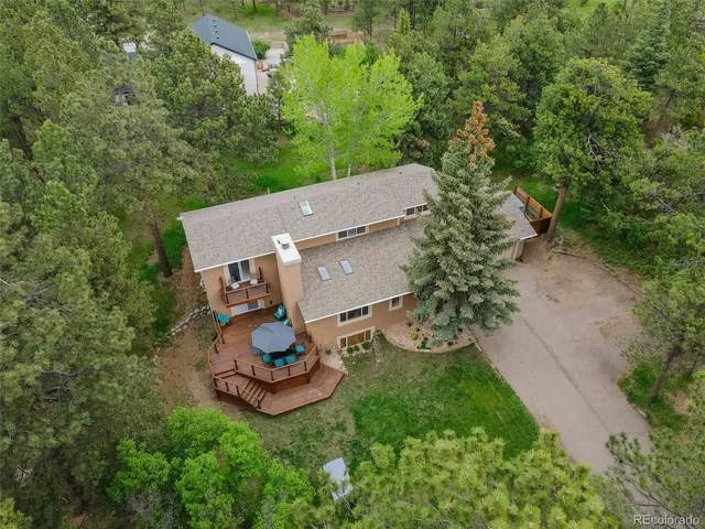 an aerial view of a house with garden