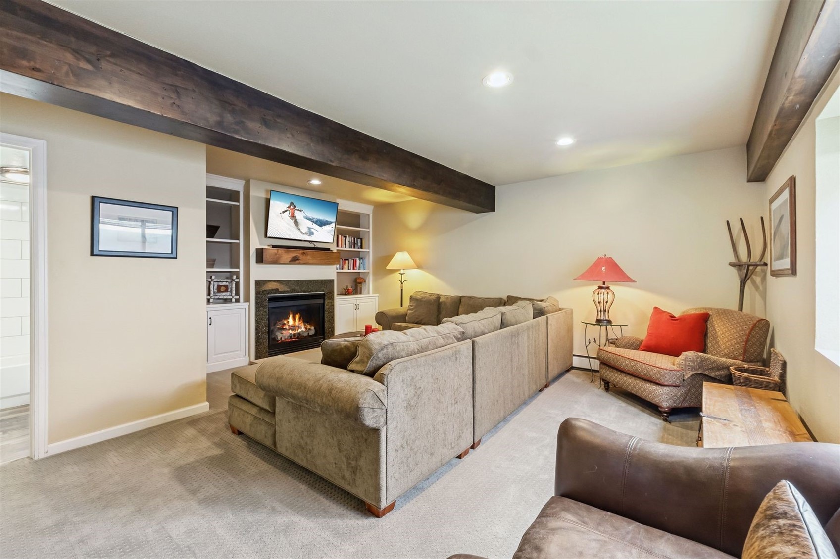 1692 Boreas Pass Road, Unit D Breckenridge, CO 80424 - Photo 23 of 33 Lower lever living room with gas fireplace and full bathroom