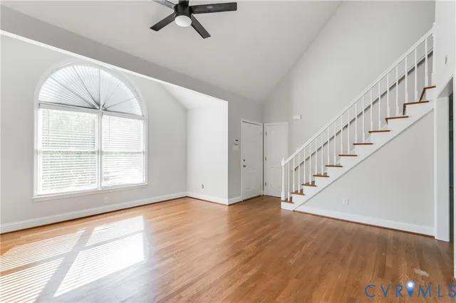 a view of an entryway with wooden floor