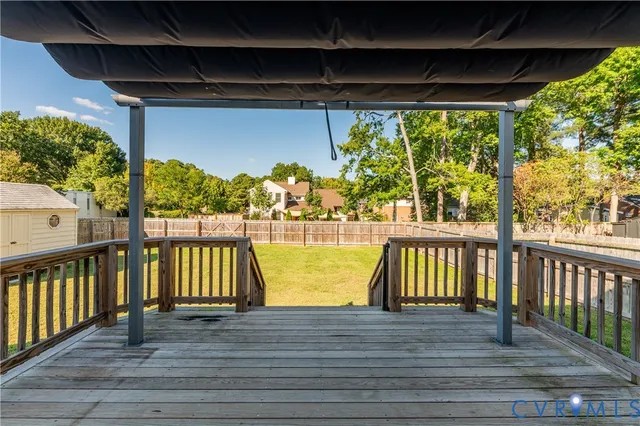 a view of a balcony with wooden floor