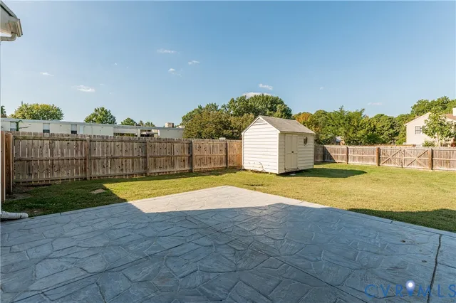 a view of outdoor space and backyard of house