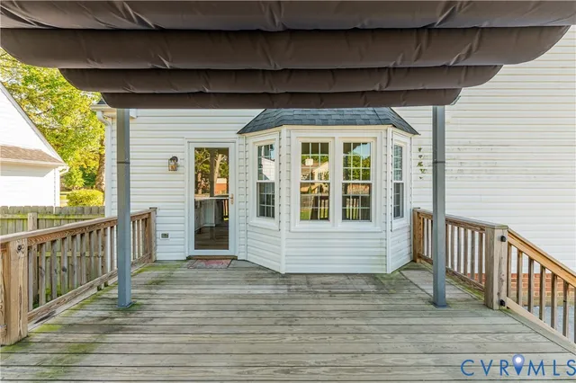 a view of a balcony with wooden floor