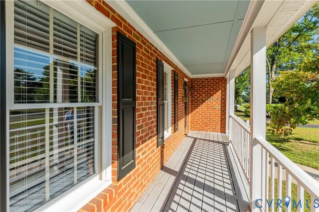 a view of a balcony with wooden floor