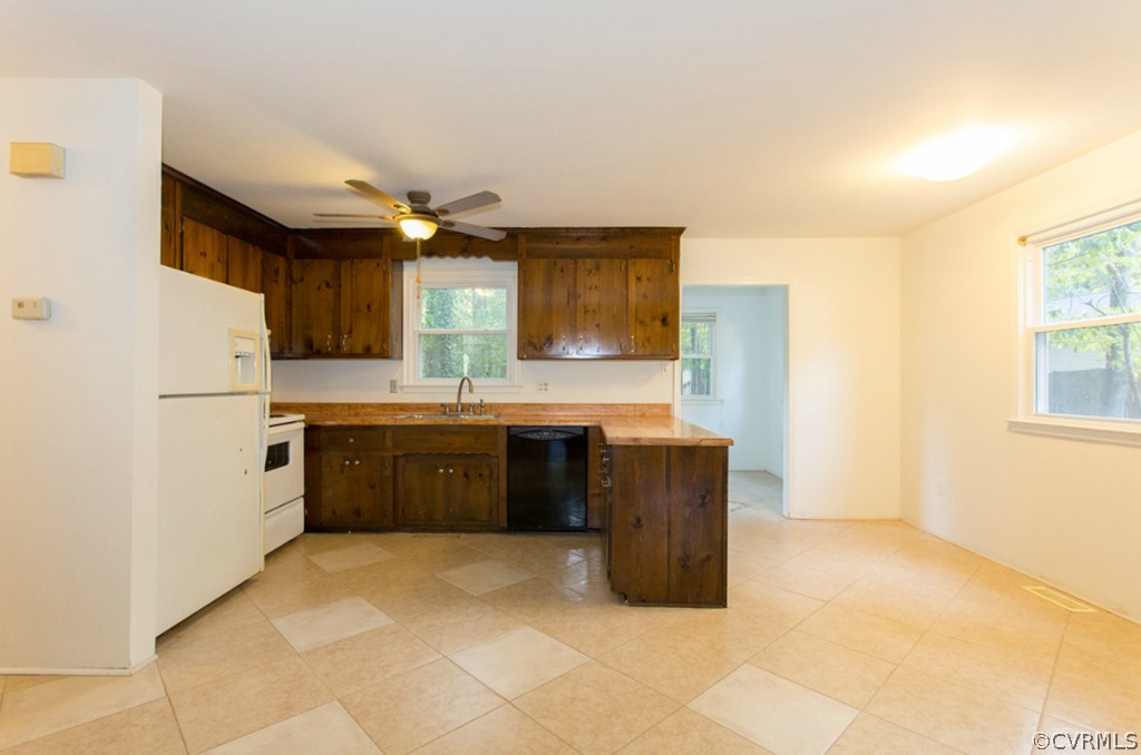 1309 Austin Road Chester, VA 23836 - Photo 8 of 24 a kitchen with stainless steel appliances a sink and a refrigerator