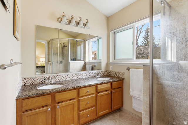 7930 Mustang Loop Road Park City, UT 84098 - Photo 12 of 23 Bathroom with a shower stall, double vanity, backsplash, and light tile patterned floors