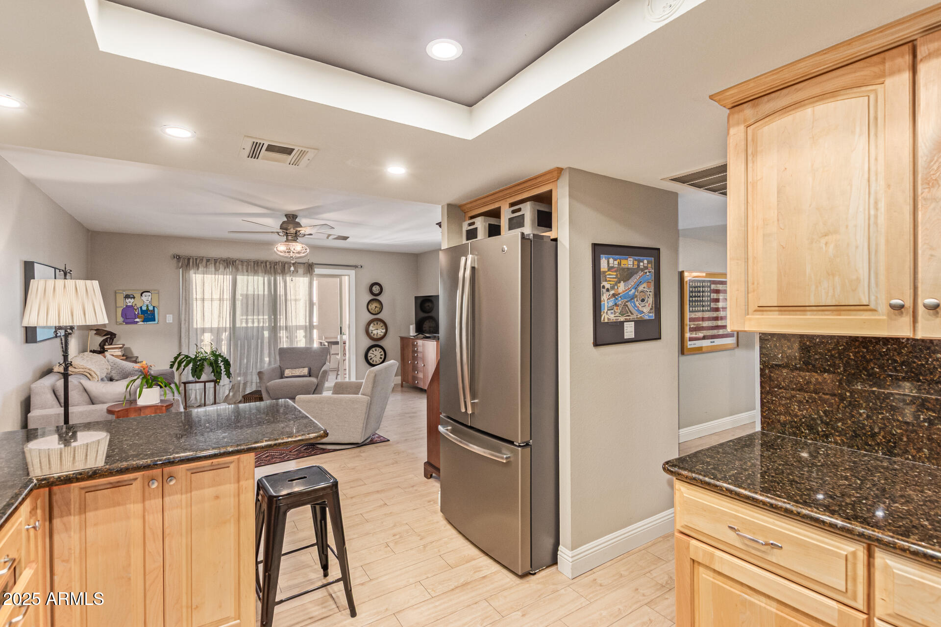 7940 East Camelback Road, Unit 605 Scottsdale, AZ 85251 - Photo 13 of 35 a kitchen with stainless steel appliances granite countertop a refrigerator and a sink