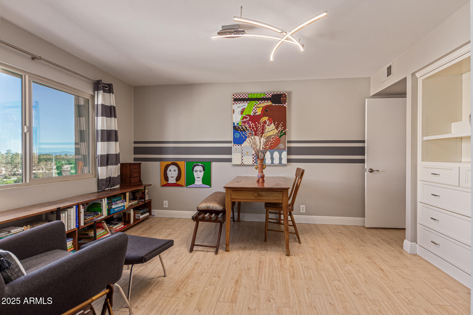 7940 East Camelback Road, Unit 605 Scottsdale, AZ 85251 - Photo 19 of 35 a view of a dining room with furniture window and wooden floor