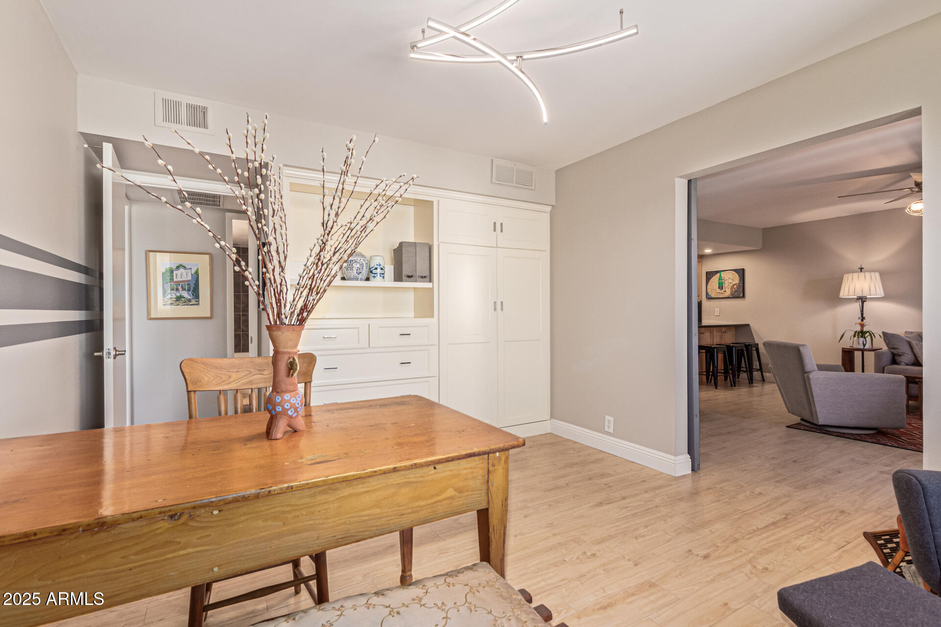 7940 East Camelback Road, Unit 605 Scottsdale, AZ 85251 - Photo 21 of 35 a view of a livingroom with furniture and wooden floor
