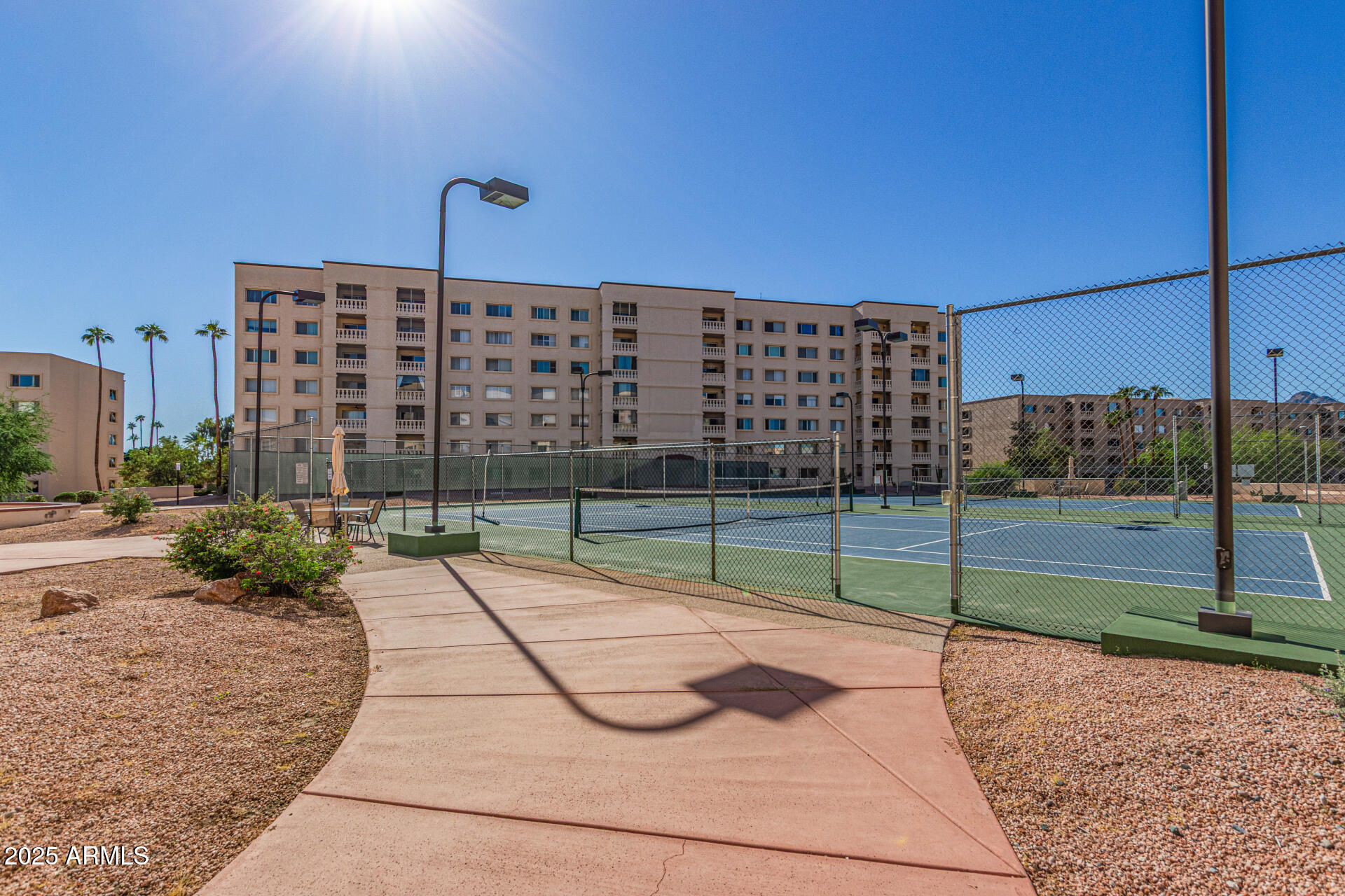 7940 East Camelback Road, Unit 605 Scottsdale, AZ 85251 - Photo 28 of 35 a view of a backyard with floor to ceiling windows