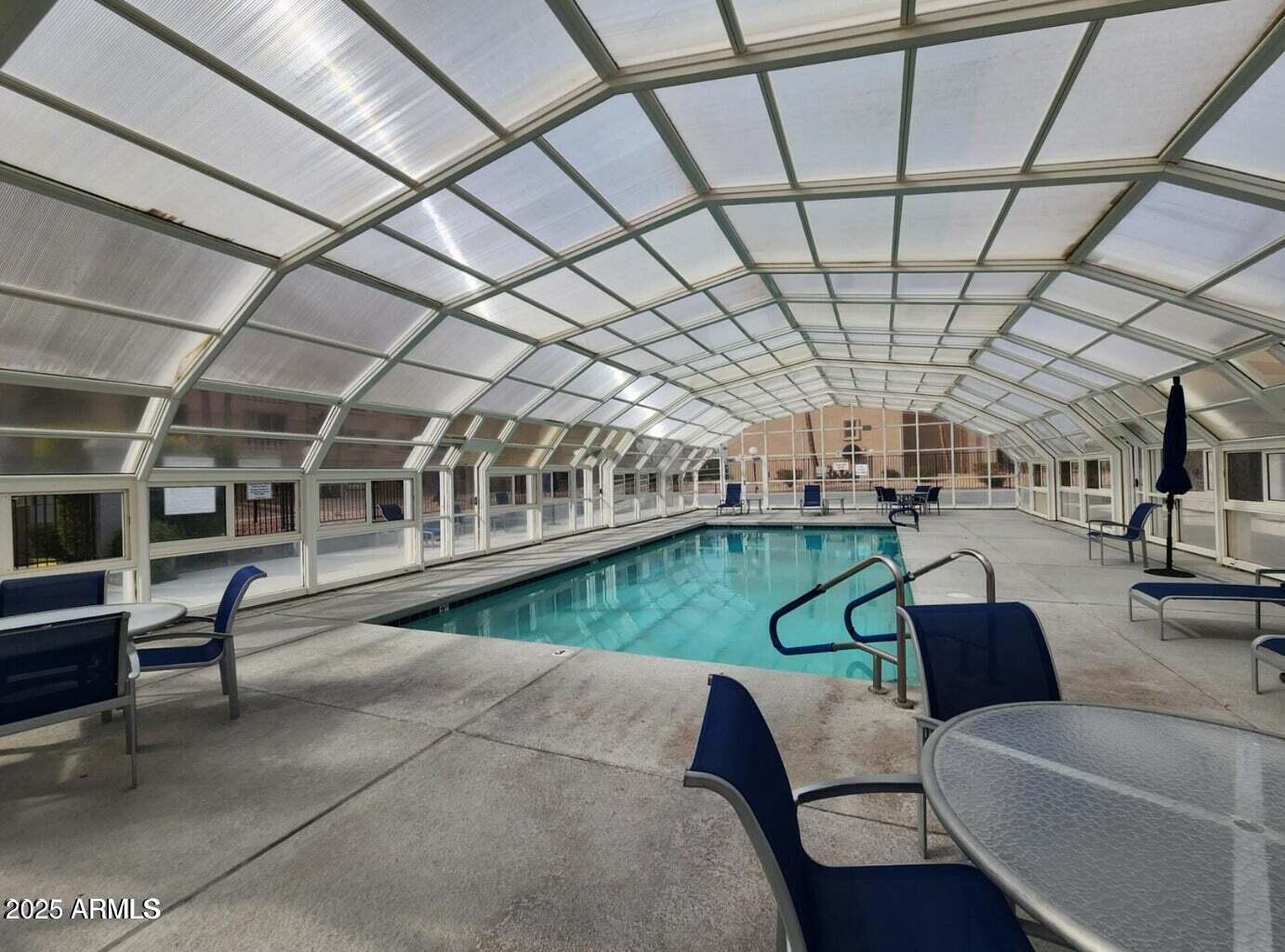 7940 East Camelback Road, Unit 605 Scottsdale, AZ 85251 - Photo 32 of 35 a view of swimming pool with outdoor seating