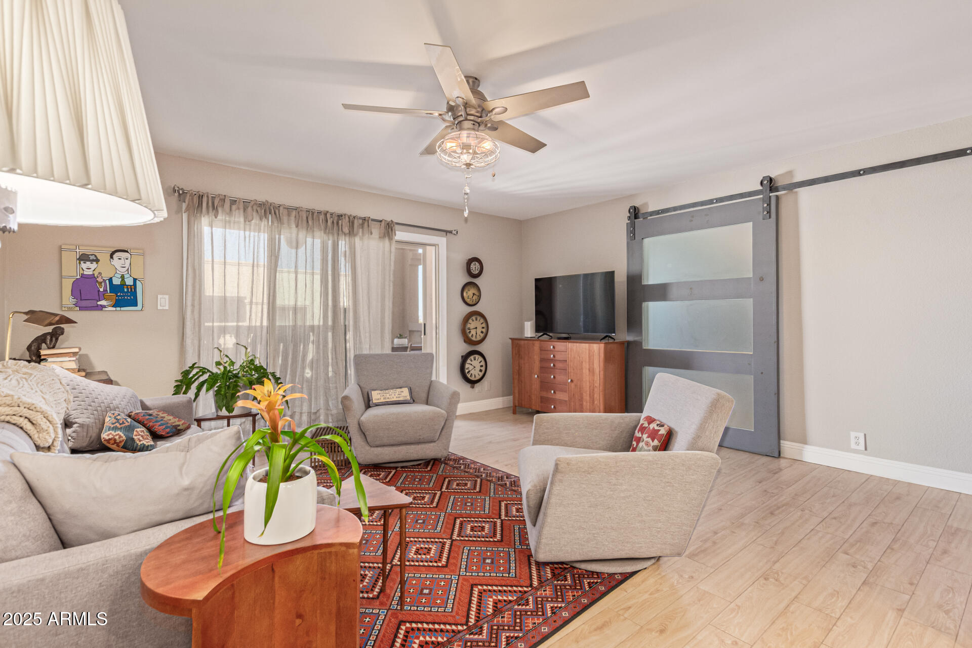7940 East Camelback Road, Unit 605 Scottsdale, AZ 85251 - Photo 9 of 35 a living room with furniture and a chandelier