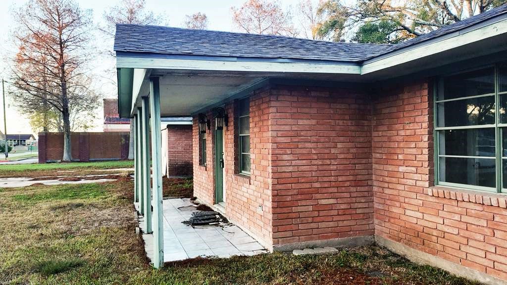 18219 Kings Lynn Street Webster, TX 77058 - Photo 6 of 6 a view of brick house with a large window