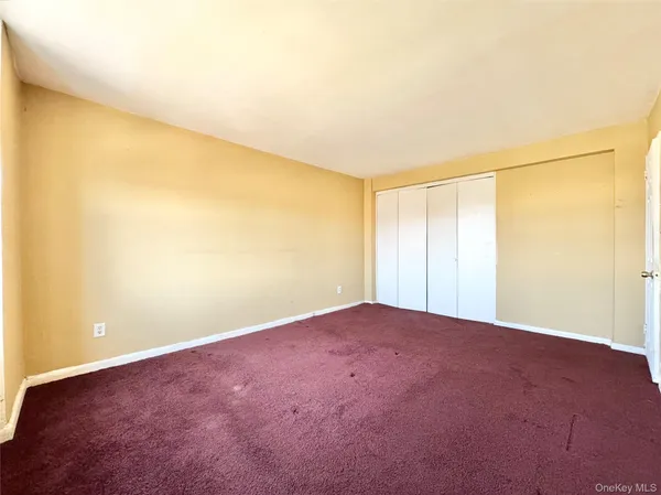 an empty room with a empty space and a window