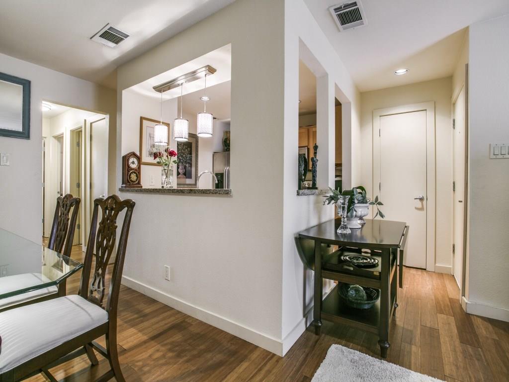 a view of a room with furniture and wooden floor