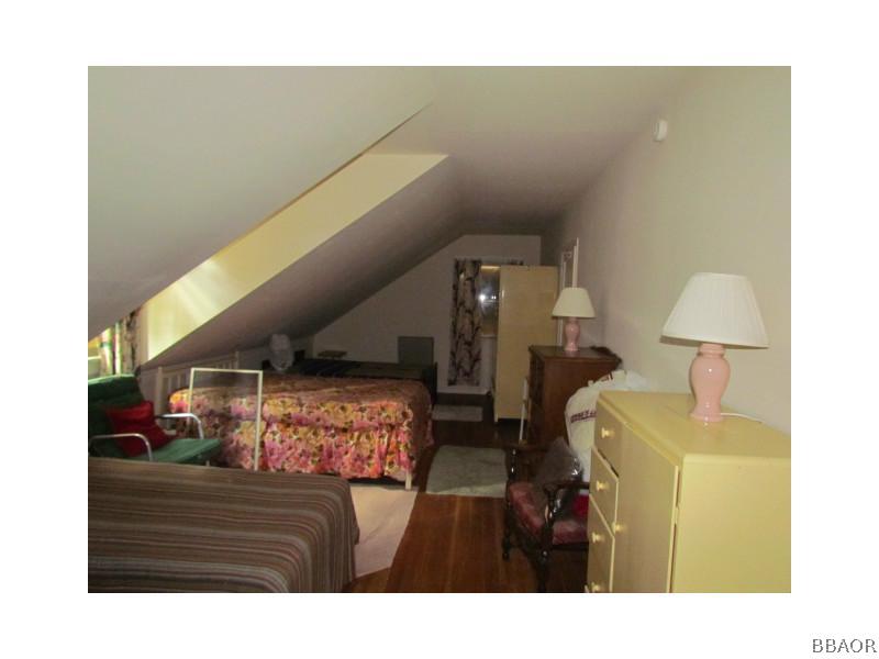 21 Holcomb Valley Road Big Bear Lake, CA 92315 - Photo 12 of 25 a living room with furniture and a wooden floor