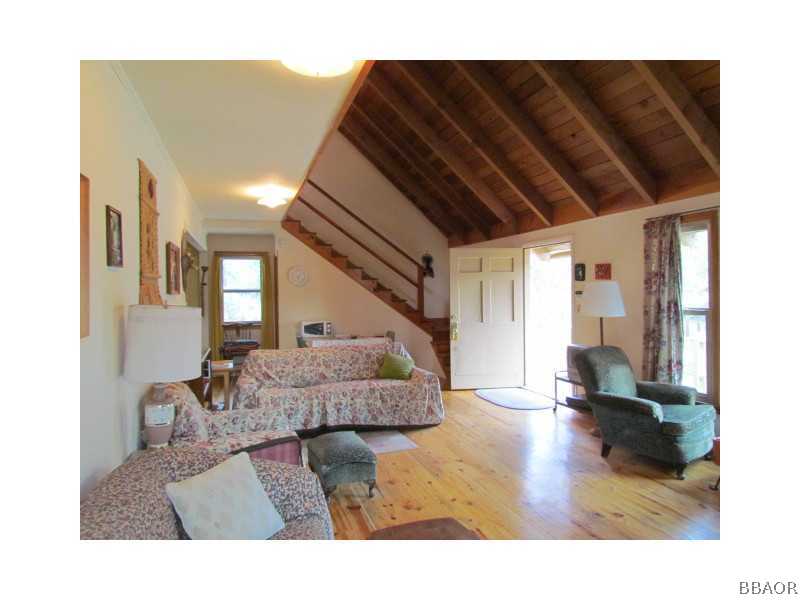21 Holcomb Valley Road Big Bear Lake, CA 92315 - Photo 3 of 25 a living room with furniture and a wooden floor