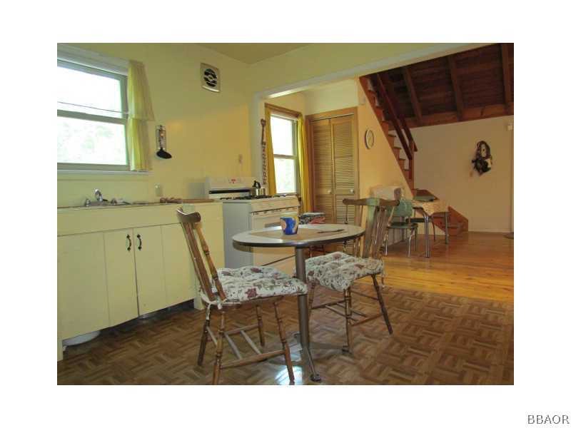 21 Holcomb Valley Road Big Bear Lake, CA 92315 - Photo 8 of 25 a view of a dining room with furniture and a table