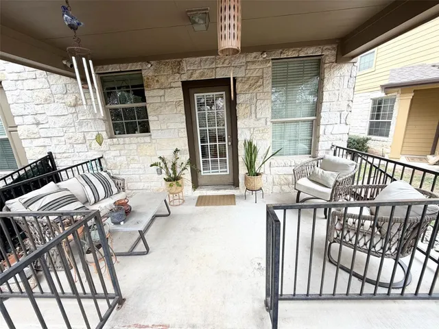 a view of a porch with furniture
