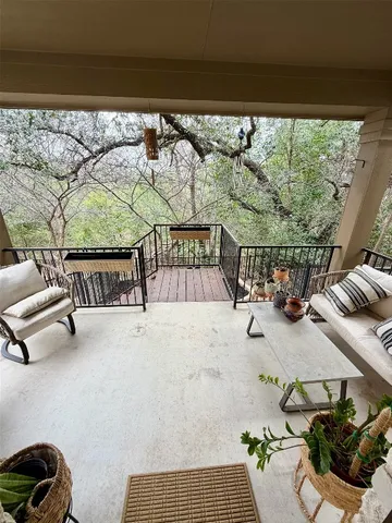 a view of roof deck with furniture